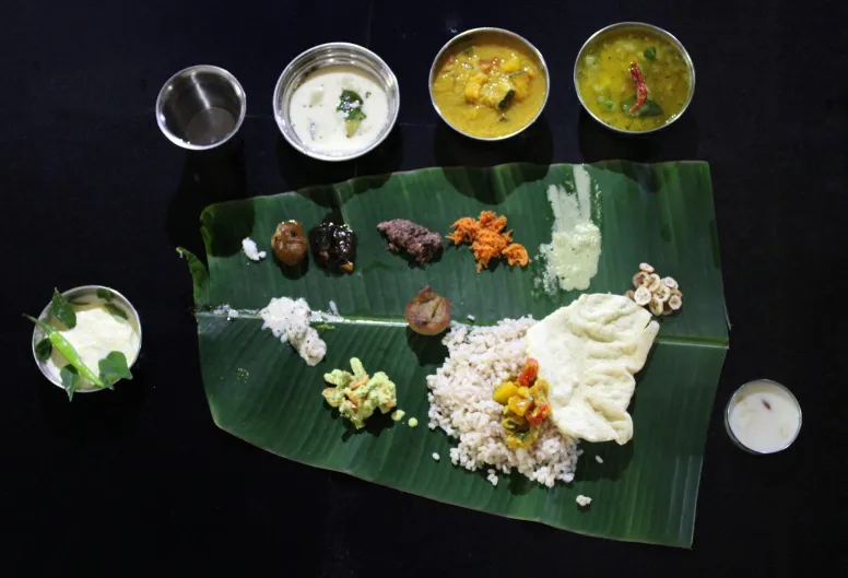 Many traditional dishes are served on banana leaves. It is an important ritual of Onam celebration.