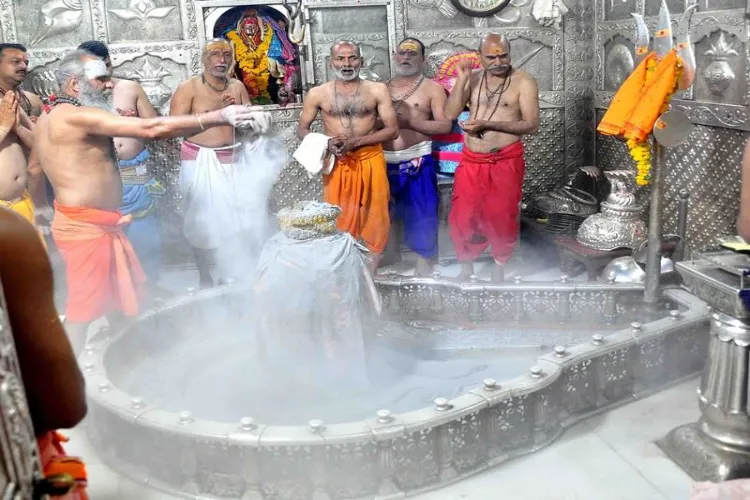 offering bhasma to shivling on mahashivratri 